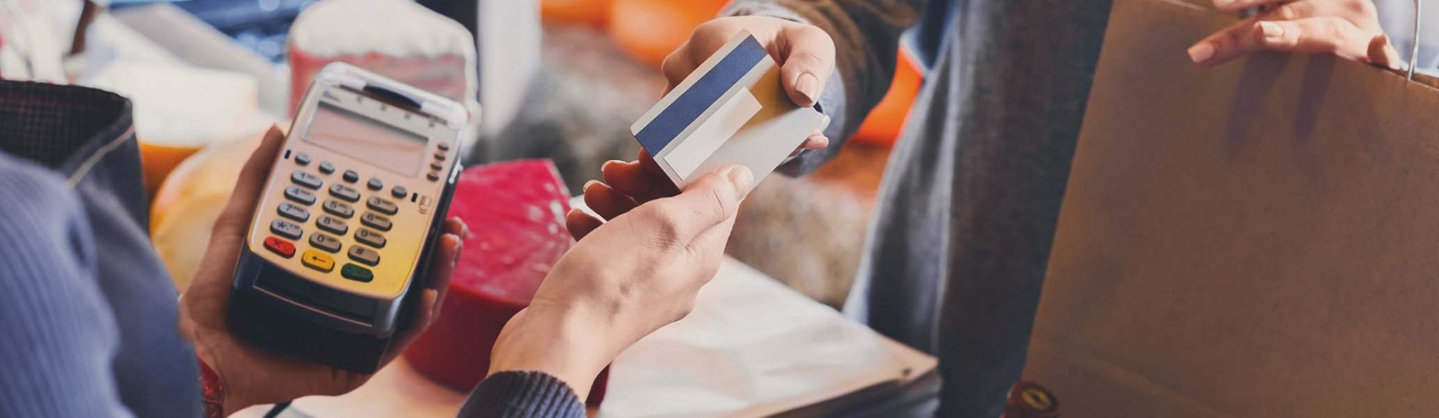 a person making a payment with their credit/debit card